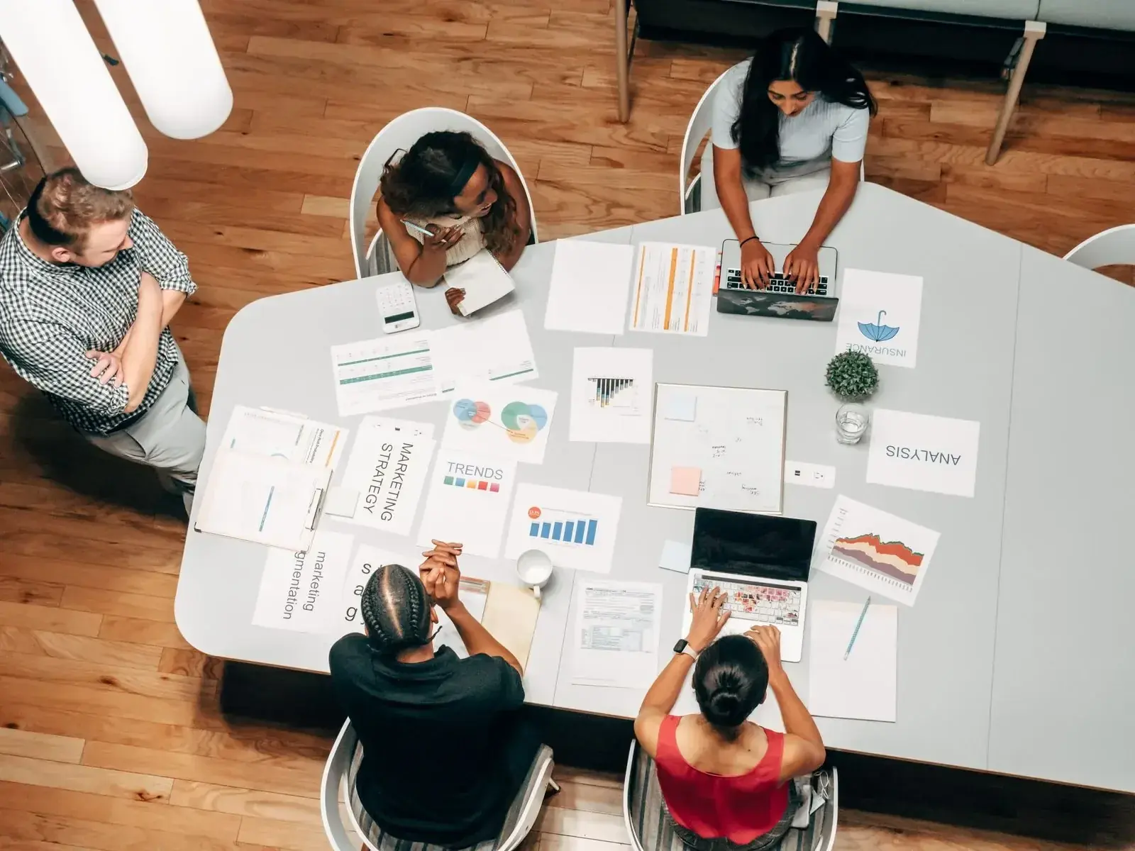Finance leaders reviewing global mobility costs, supplier governance and international workforce flexibility in a modern office