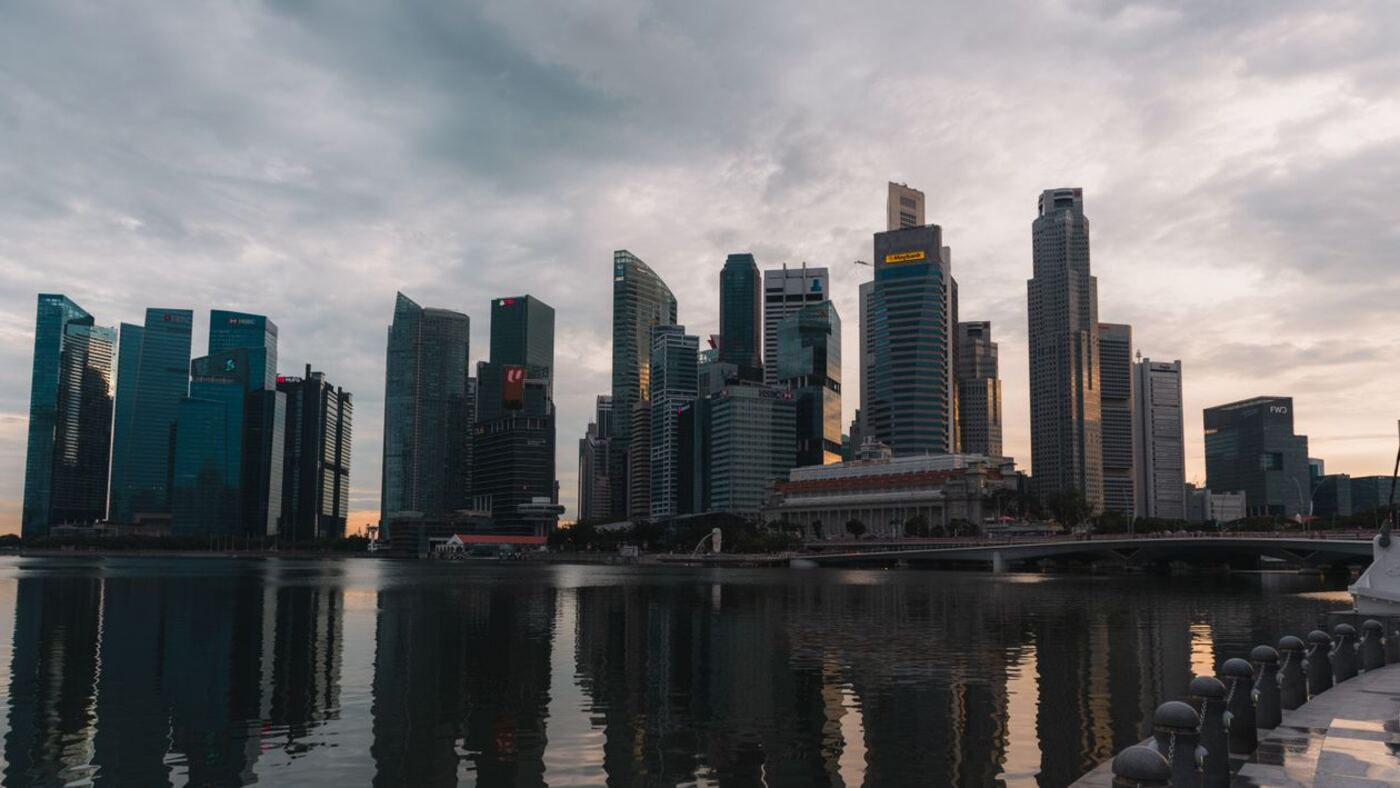 Singapore skyline representing Employment Pass and S Pass relocations.