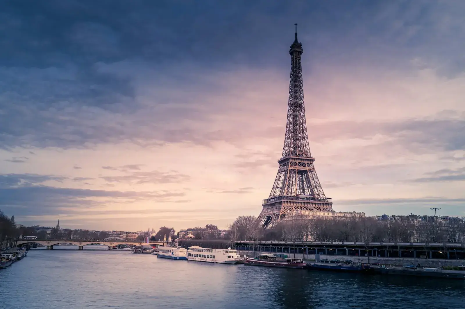 Paris skyline with the Eiffel Tower at sunset, illustrating France as a destination for international talent.