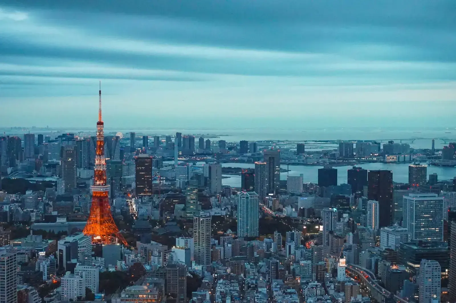 Tokyo skyline representing Japan's October 2026 permanent residency fee and income rule changes.