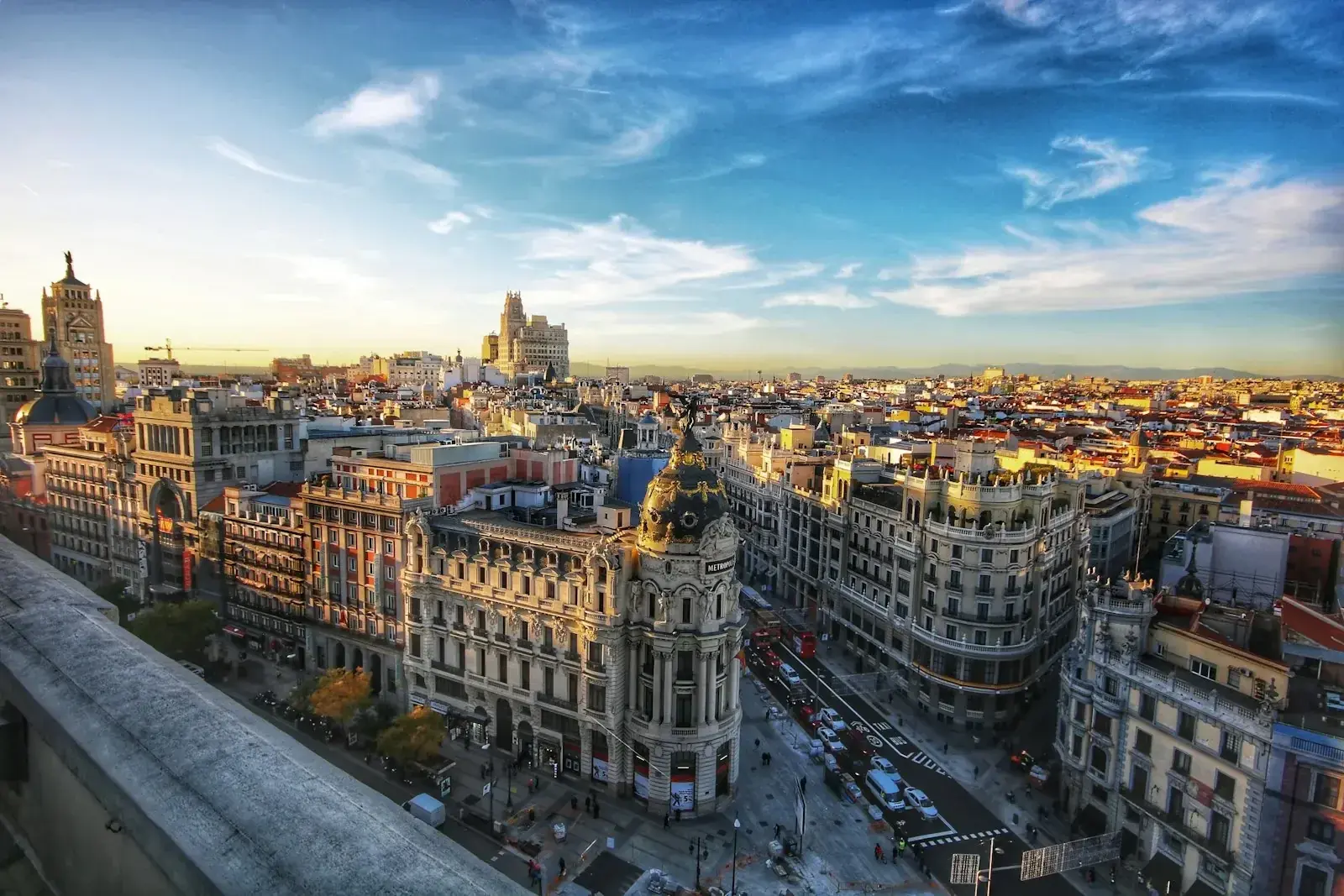 Aerial view of Madrid's Gran Vía at dusk with classic Spanish architecture, illustrating Spain as a destination for international assignees and expatriate hires.