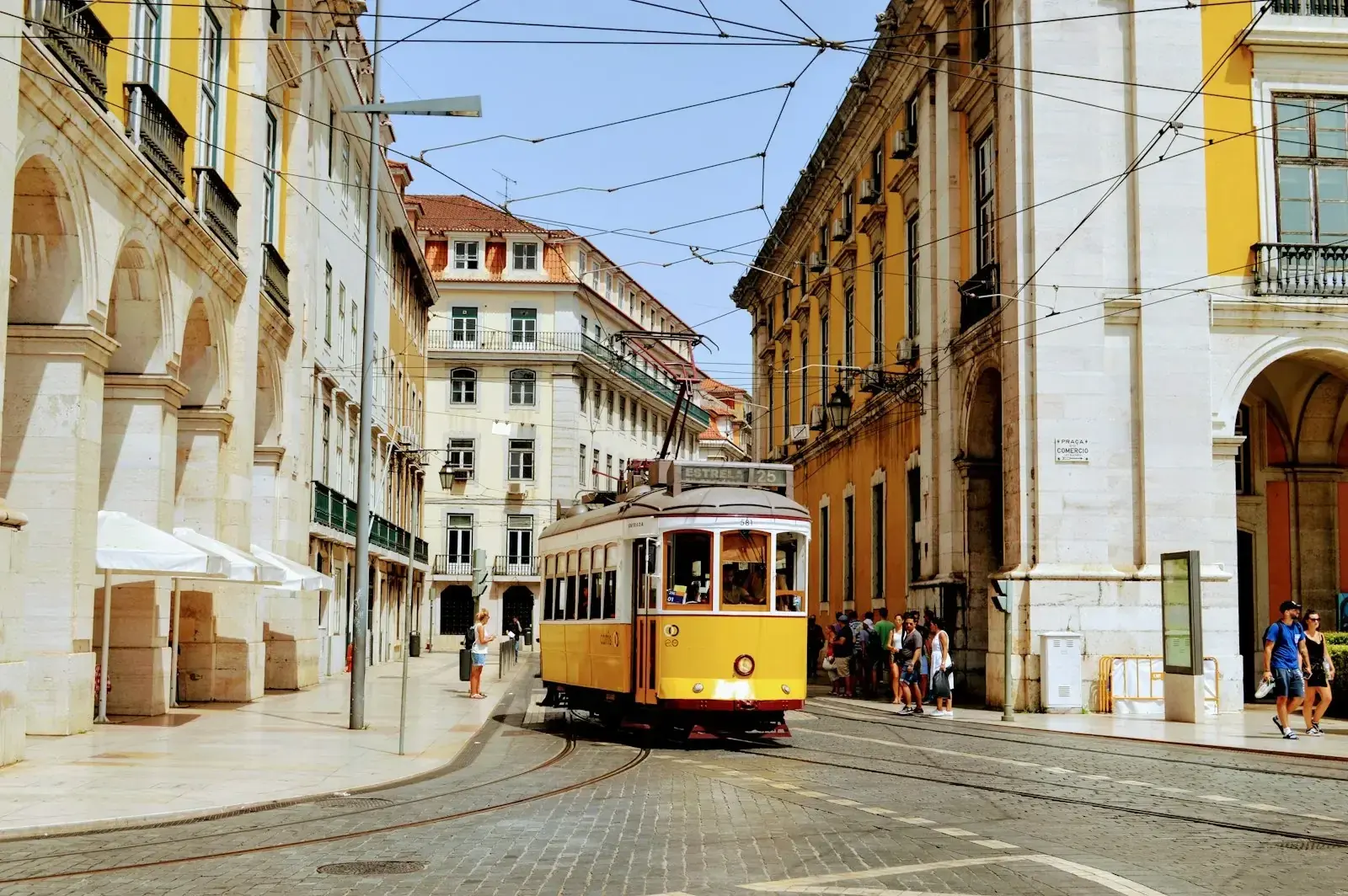 Lisbon cityscape, representing the choice between Portugal D2 and D3 visa routes for relocating employees in 2026