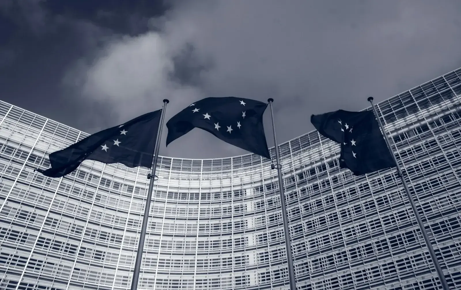 EU flag and European Parliament building representing revised posted worker and A1 certificate rules entering into force in September 2026.