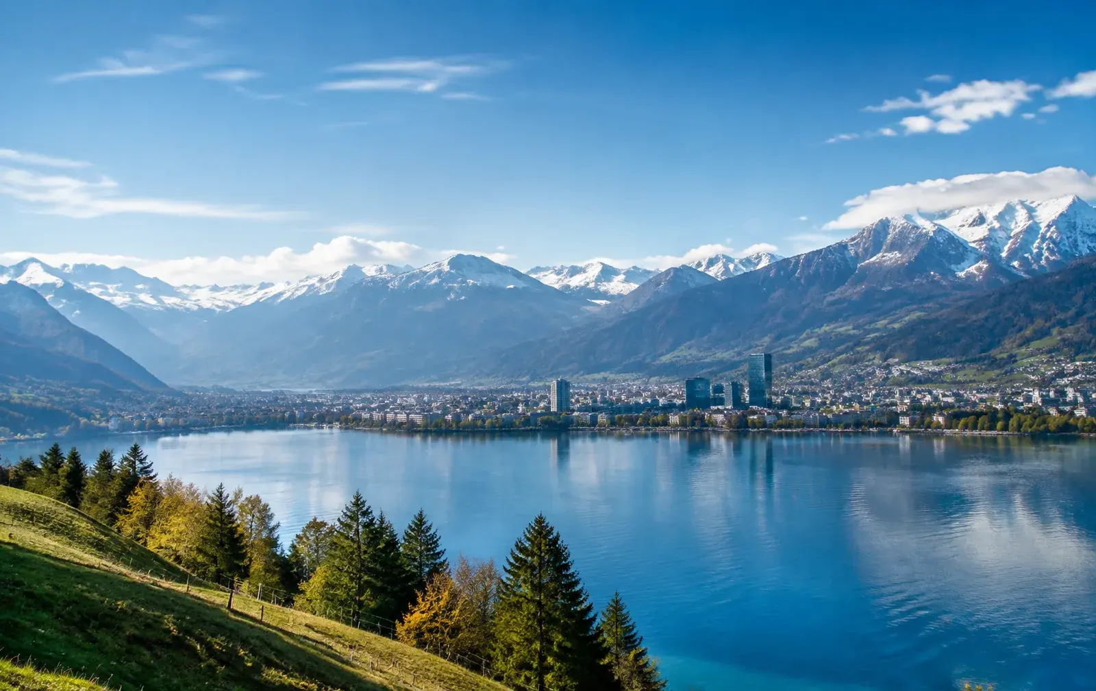 Swiss Alps mountain landscape with lake, representing Switzerland's flat 2026 work permit quotas and rising salary floor.