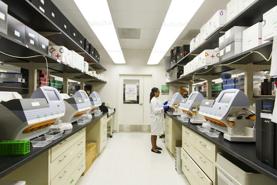 Laboratory corridor with researchers and lab equipment