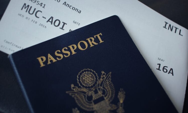 passport booklet on top of white paper