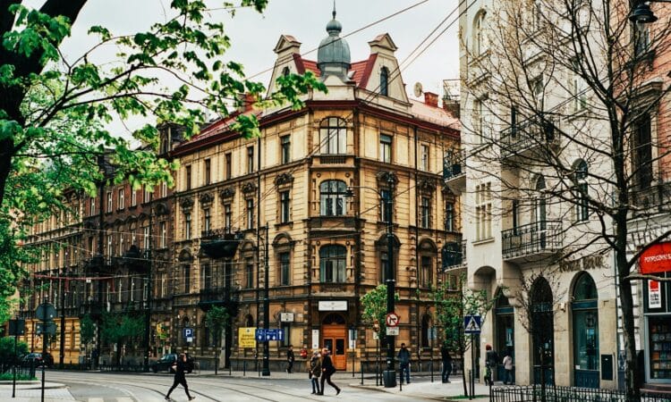 people walking near beige building