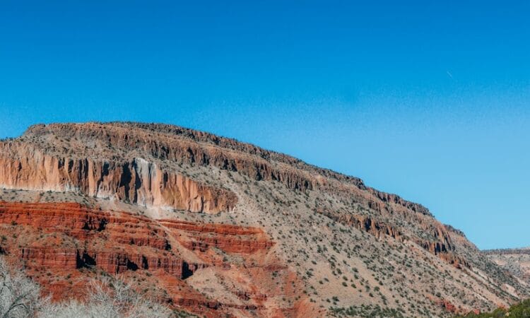 brown rocky mountain under blue sky during daytime