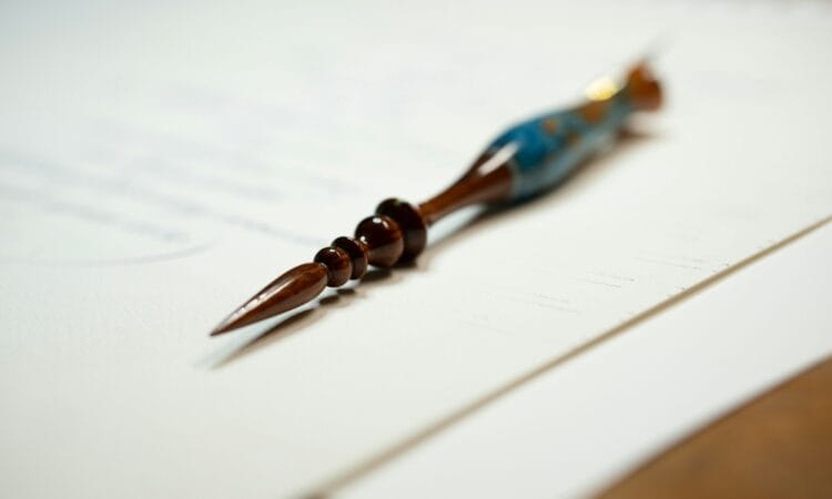 a close up of a pen on a piece of paper