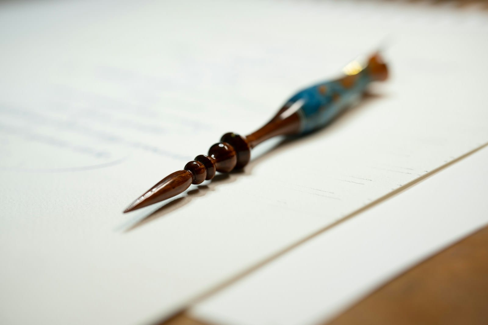 a close up of a pen on a piece of paper