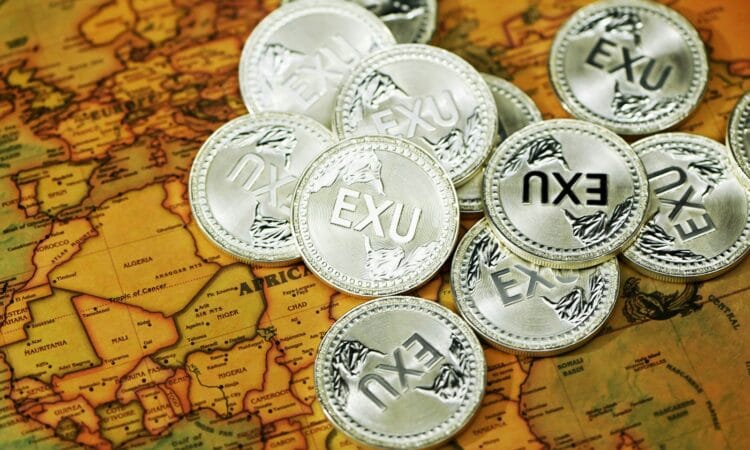 silver round coins on brown textile