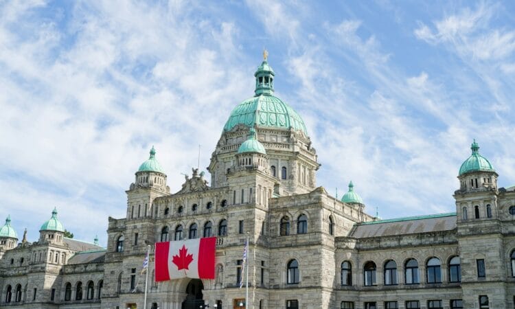 The british columbia parliament buildings display the canadian flag.